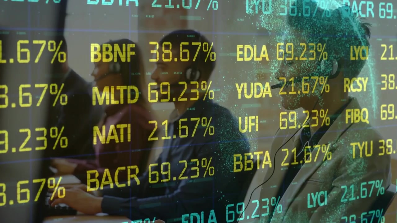 Animation of trading board and globe over multiracial coworker wearing headphones and using desktops