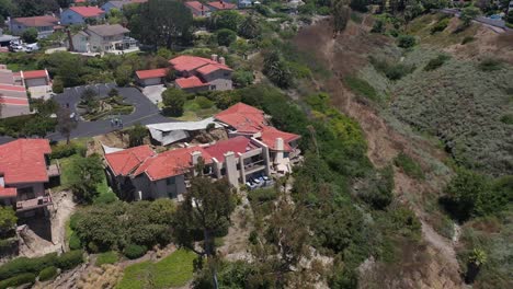 houses falling off cliff due to erosion