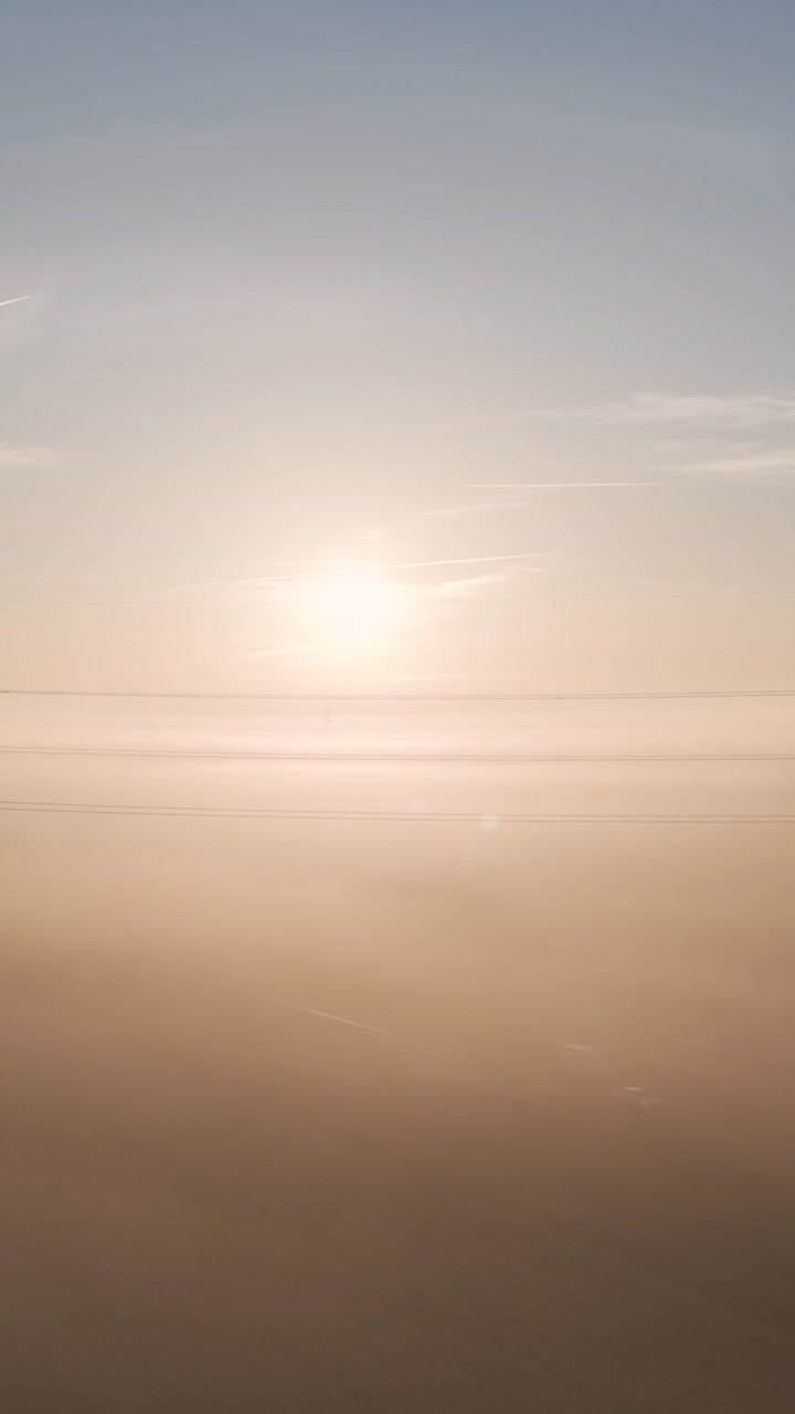 Sunrise over a foggy highway