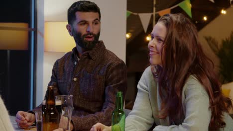 Group-Of-Friends-At-Home-Or-In-Bar-Celebrating-At-St-Patrick's-Day-Party-Drinking-Alcohol-Together