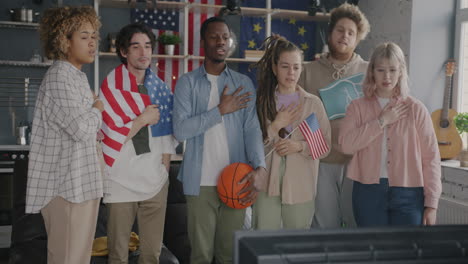 Friends Watching a Basketball Game and Showing National Pride
