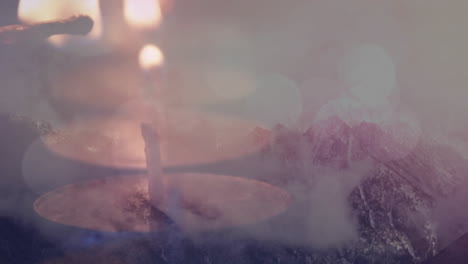 burning candles over misty mountain landscape in animation