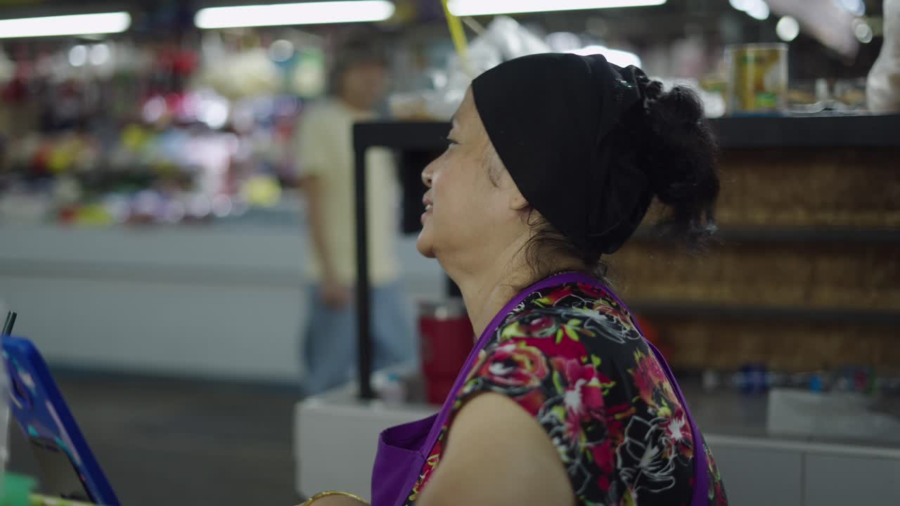 Woman working at an Asian market