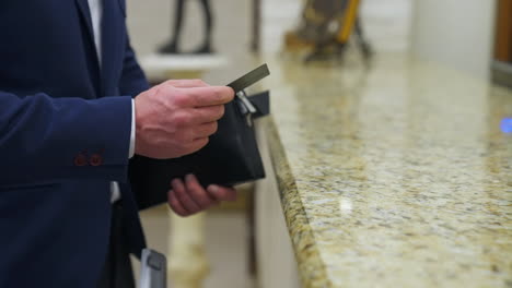 registration desk in modern hotel. man checks in on arrival at the hotel