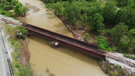 devastating aerial view of flood erosion: debris and destroyed railroad tracks, vermont usa