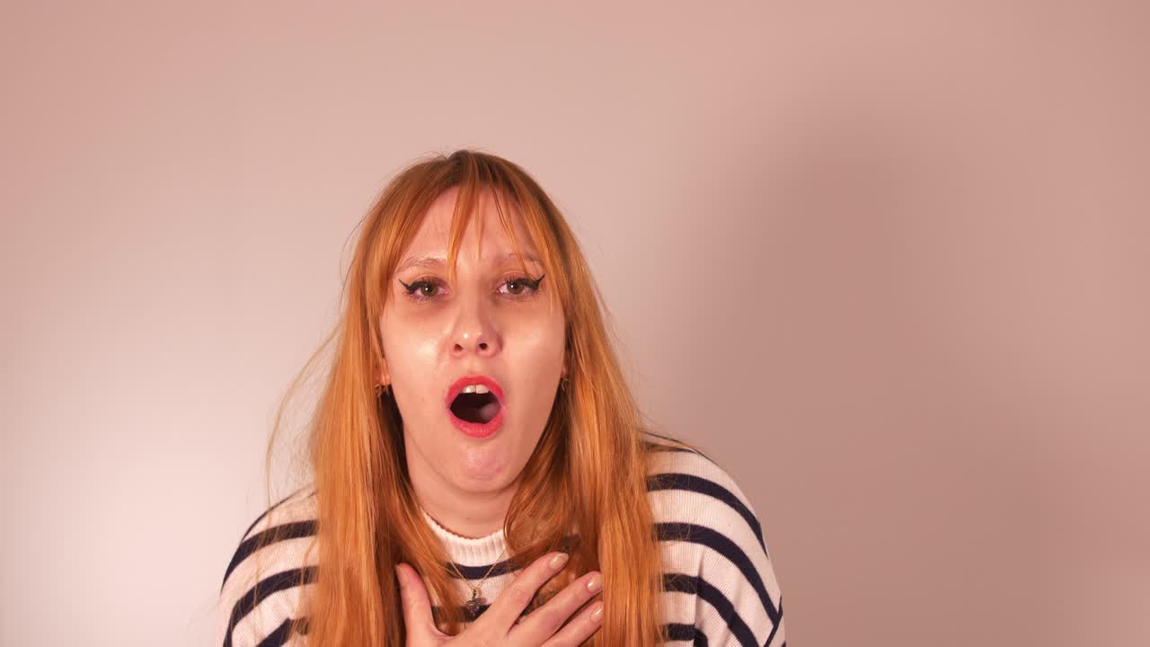 Beautiful girl exagerating on a dramatic scene