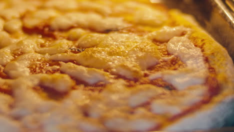 baking pizza with bubbling cheese and golden crust in oven