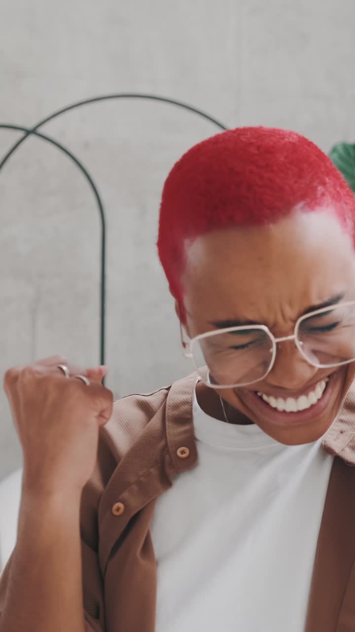 Celebrating joy and style with vibrant hair in a modern setting