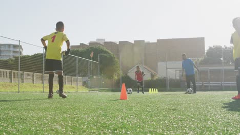 soccer kids exercising in a sunny day