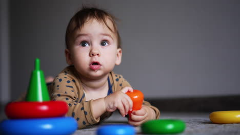 baby playing with stacking rings