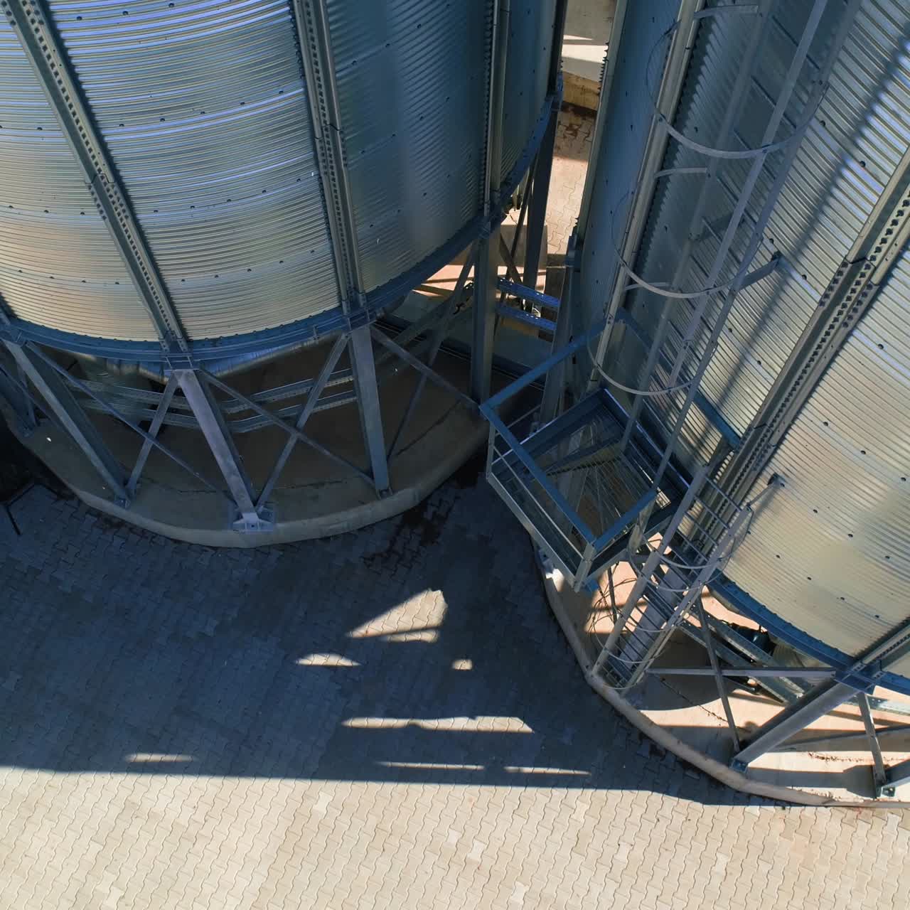 Grain Cooperative. Large aluminum containers for storing loose grain. Aerial view
