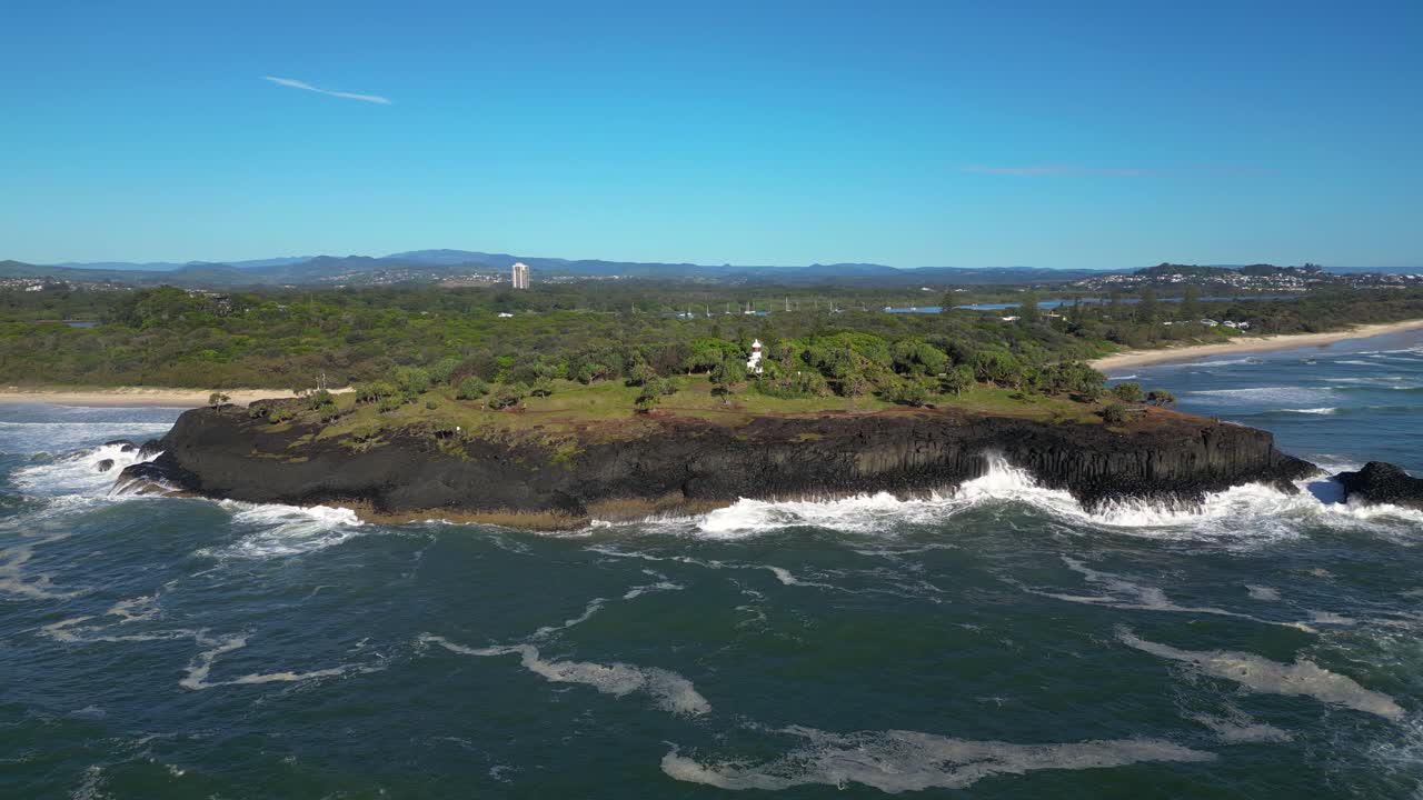 Left to right moving aerial over Fingal Head towards the Southern Gold Coast, Northern New South Wales, Australia