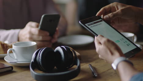 business people hands using smartphone browsing working online collaborating on mobile phone networking together friends relaxing in cafe drinking coffee enjoying leisure lifestyle close up