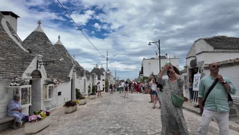 walking through the charming streets of alberobello, italy