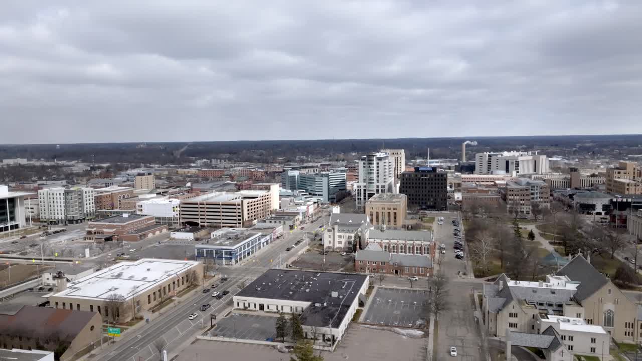 Kalamazoo, Michigan downtown with drone video moving up.