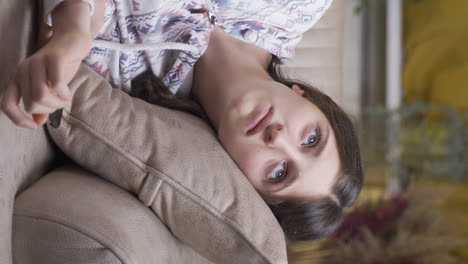 Vertical-video-of-Abandoned-young-woman.-Home-alone-and-depressed-at-night.