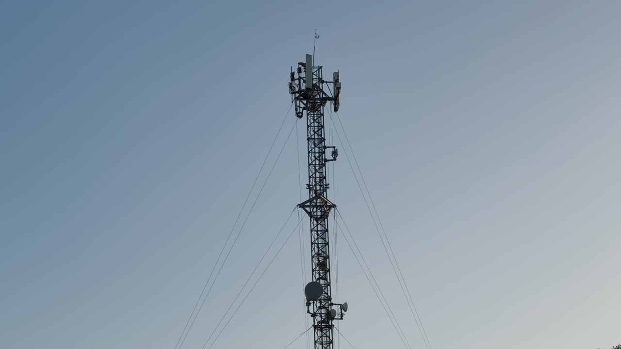 A very tall TV Antenna in Tijuana, Mexico. Tilt-up shot