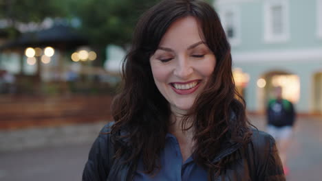 close-up-portrait-of-lovely-elegant-woman-smiling-at-camera-enjoying-peaceful-urban-evening