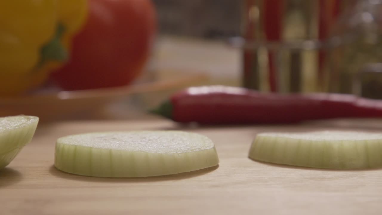 Sliced Onion on a Chopping Board with Other Vegetables