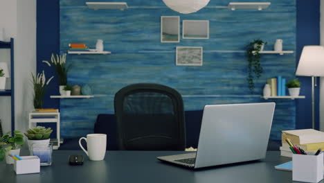 Empty-workspace-of-freelancer-worker-with-laptop-computer-on-desk