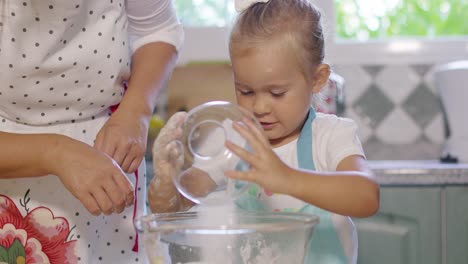 happy pretty little girl learning baking