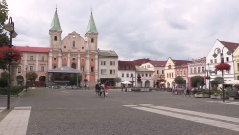 market or main square in zilina with church in slovakia, europe