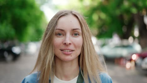 attractive european girl with soft smile, walks outdoors