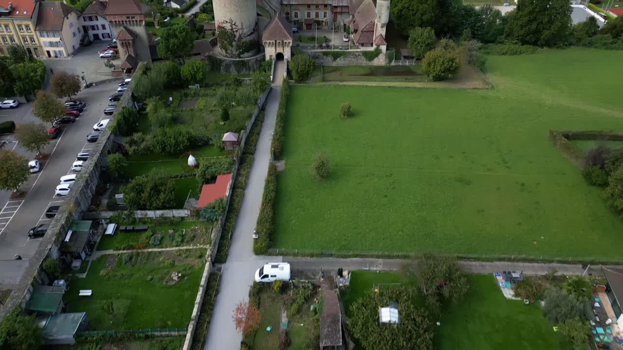 Reveal drone shot of Chenaux Castle in Estavayer-le-Lac in Canton of Fribourg