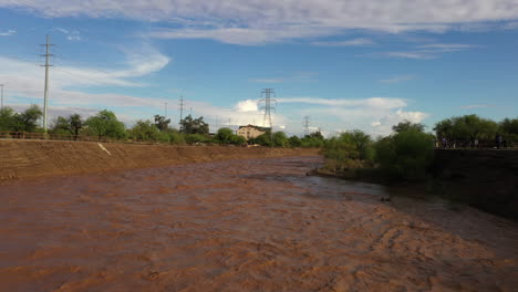 Raging-Muddy-Waters-Of-Santa-Cruz-River-After-Monsoon-Rain-In-Tucson,-Arizona