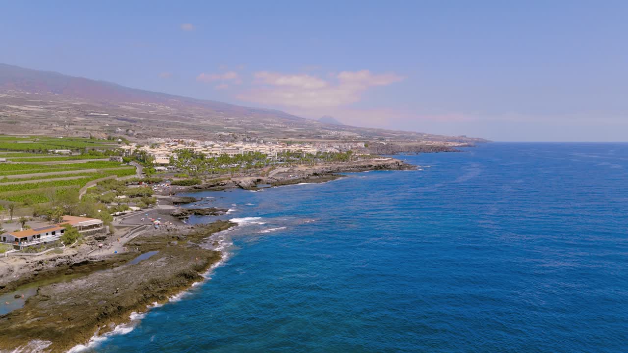 Scenic coastline view of natural pools in Alcalá, Tenerife, relaxing vibe
