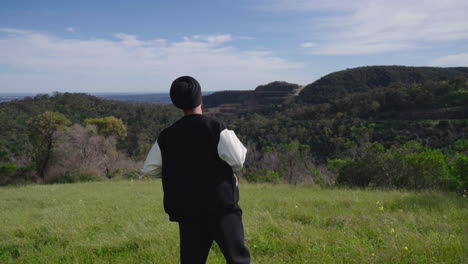 indian sikh man appreciating beauty in nature - wide shot