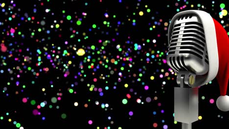 santa hat over microphone against colorful spots of light against black background