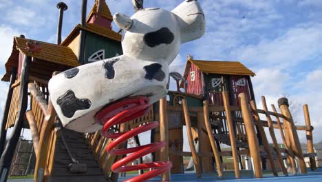 low angle shot of of empty playground during sunny day with blue sky - no people, no children