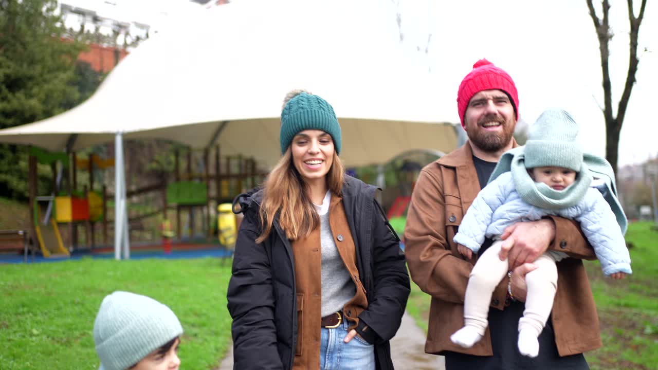 Family enjoying time together at the park in winter