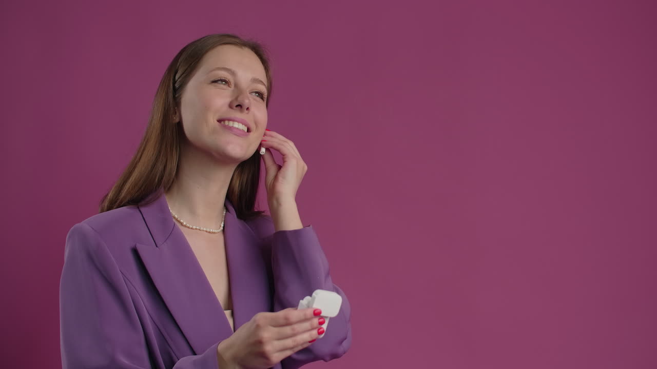 Woman in Purple Blazer with Earbuds