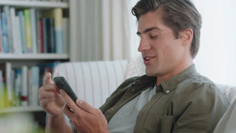 happy-young-man-having-video-chat-using-smartphone-chatting-to-girlfriend-online-blowing-kiss-enjoying-long-distance-relationship-relaxing-at-home-4k-footage