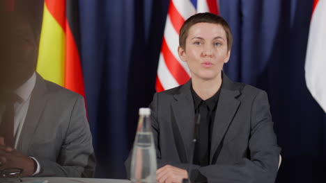 female politician speaking with journalist at press conference
