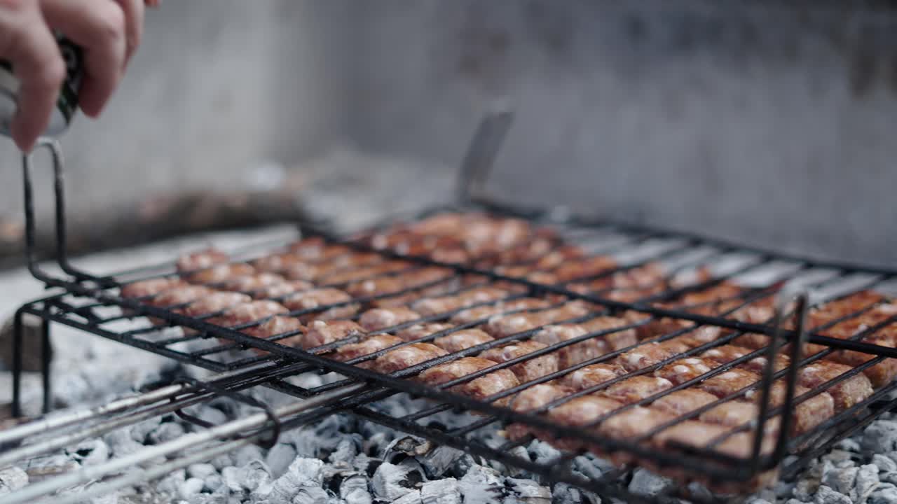 Sausages cooking on a grill