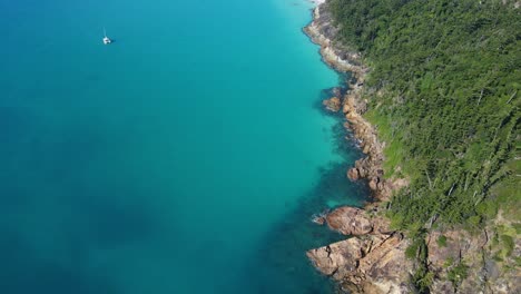 aerial view of whitehaven beach northern end in whitsunday island, great barrier reef, qld with boat adrift on turquoise blue sea in summer