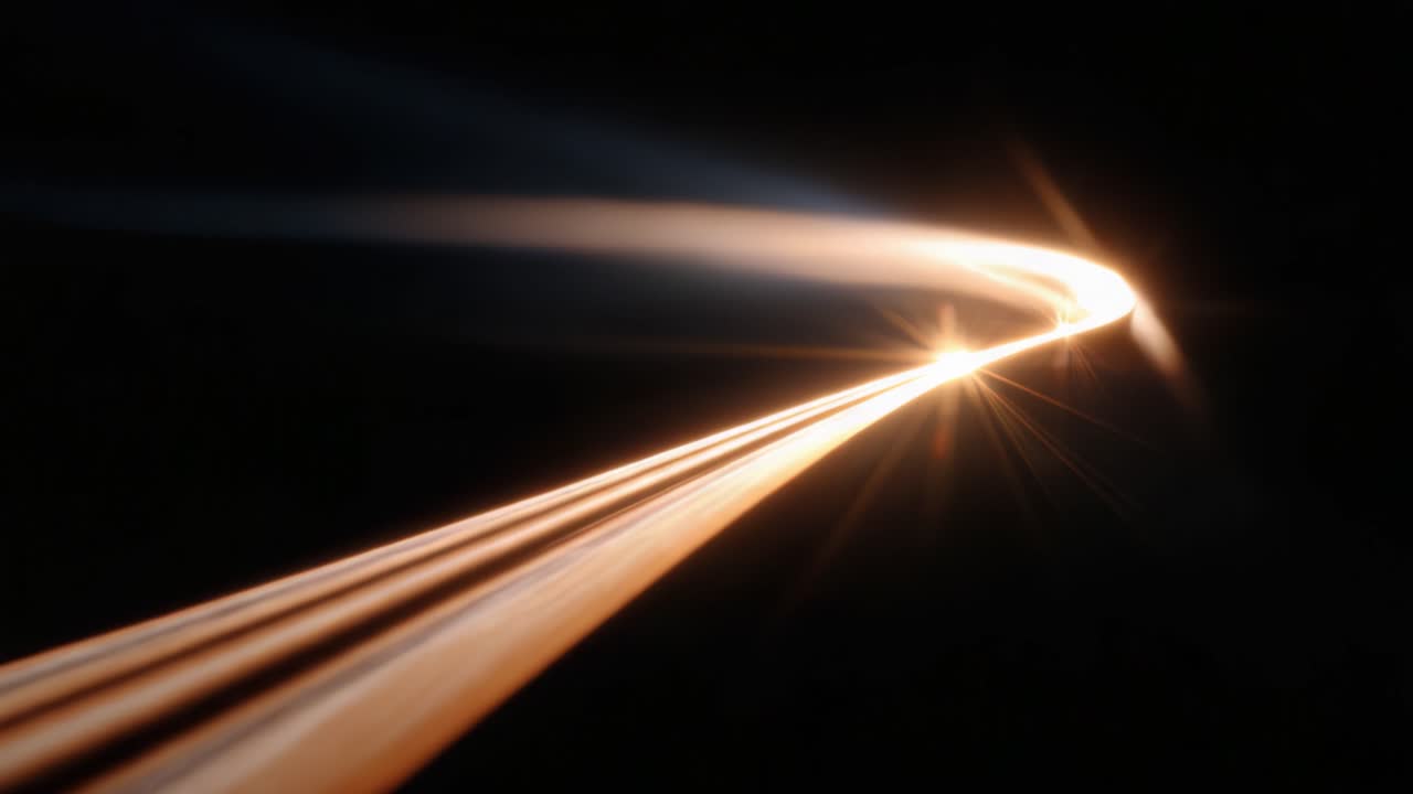 Een verbluffende afbeelding van dynamische lichtsporen tegen een zwarte achtergrond, die de essentie van beweging en energie vastlegt door middel van abstracte patronen en stralende kleuren