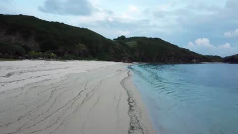 AERIAL-4K-Flyover-Beautiful-Isolated-Beach-with-Blue-Waters,-Indonesia