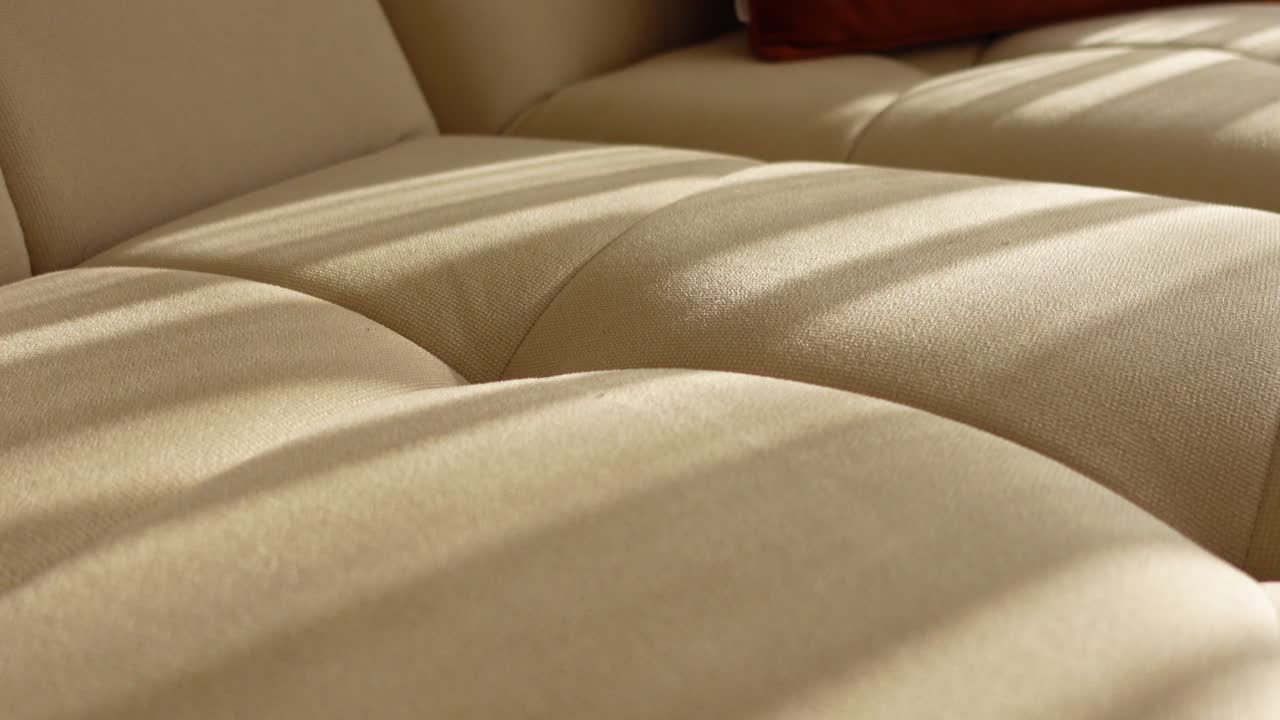 Close-up of a beige fabric couch