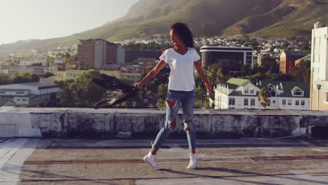 Fashionable-young-woman-on-urban-rooftop-turning-round-and-swingin-her-jacket