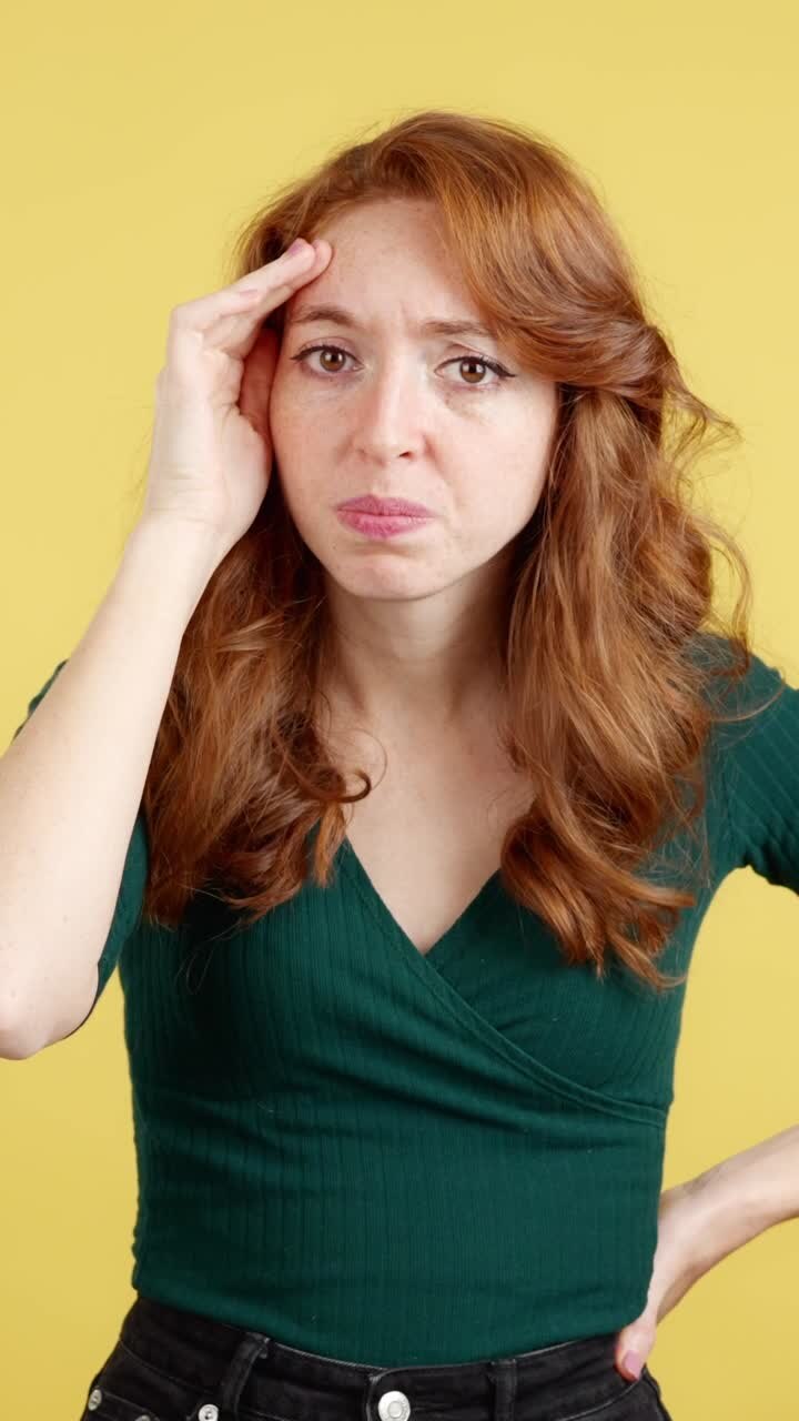 A woman with red hair expressing various negative emotions like frustration, disgust, and annoyance against a yellow background