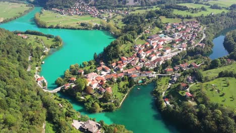 aerial view of most na soci lake with beautiful turquoise colors near tolmin in slovenia