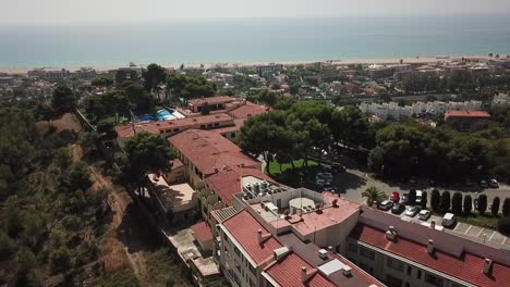 Drone-footage-passin-on-top-of-a-building-getting-close-to-the-sea