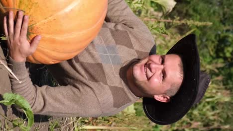 a farmer hugs a pumpkin in the garden farming and agriculture a farmer hugs a pumpkin in the garden autumn scene ecological health concept fresh products farming and agriculture