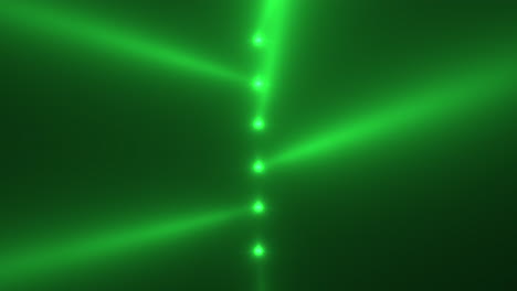 Green-glowing-spotlight-beams-on-black-gradient-stage