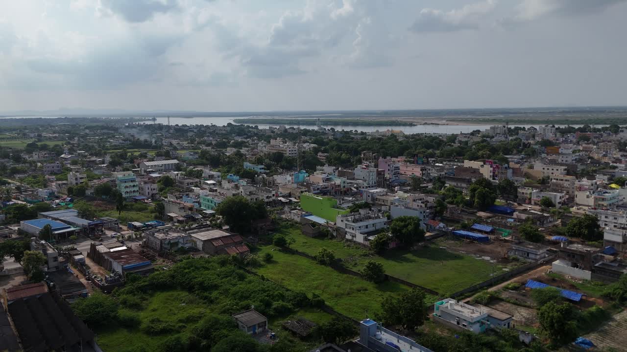 A beautiful drone shot of Vijayawada capturing the essence of city life with a scenic hill in the background.
