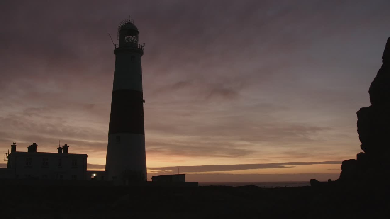Beautiful sunrise at Portland Bill Lighthouse in UK. Time lapse